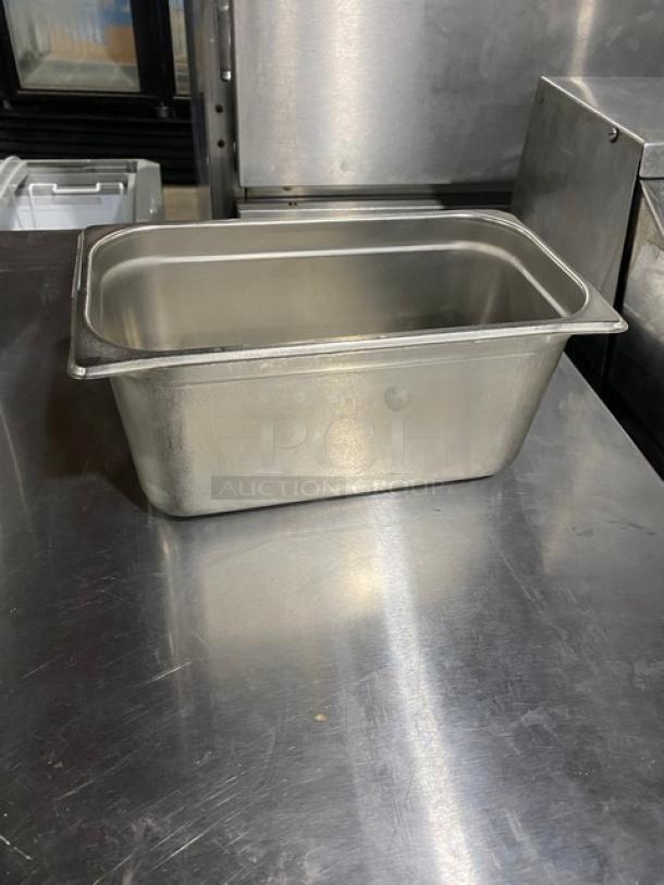 Commercial stainless steel steamtable pan, rectangular, durable, shiny finish, excellent condition, ideal for hotel use.