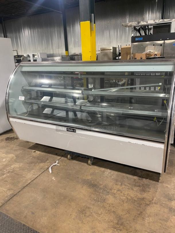 Leader Commercial Stainless Steel Curved Glass 96" Refrigerated Display Case, Model NRHD96R, with sliding doors and storage.