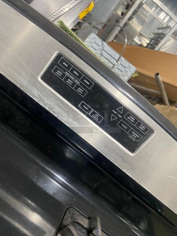 Amana Commercial 4-burner range/oven, stainless steel and black, digital push-button controls, wired oven rack included.