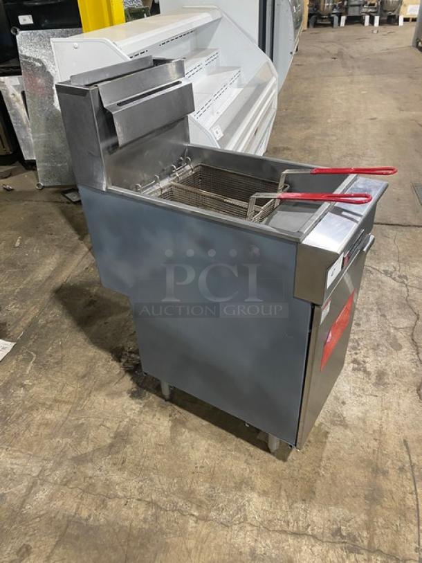 Cookline commercial stainless steel deep fat fryer with backsplash, basket hanger, fry baskets, and legs. Natural gas powered.