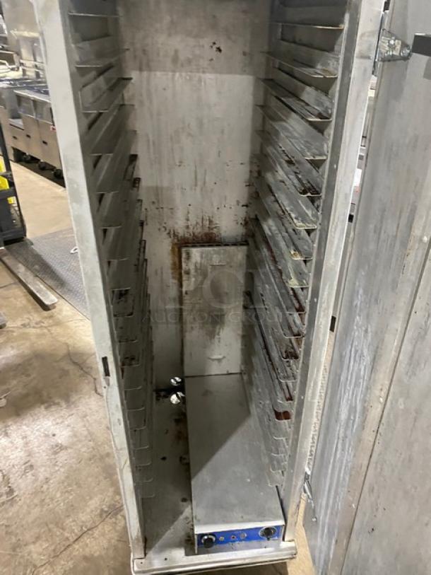 Precision commercial electric heated holding/proofing cabinet with built-in pan slides, on casters, showing interior and control panel.