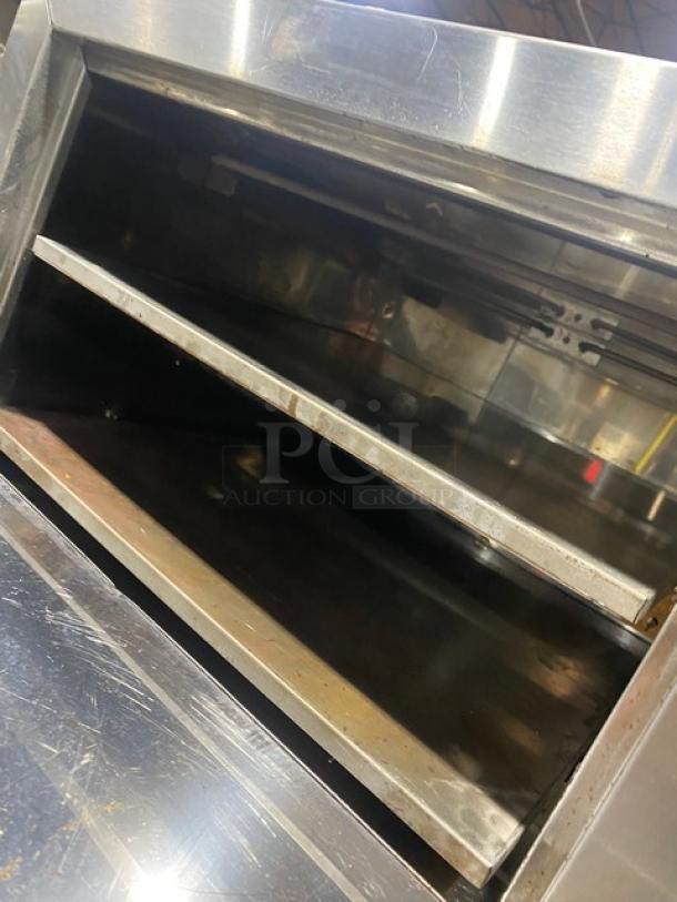 Nemco Model 6205 stainless steel countertop pizza deck oven, electric-powered, single compartment, with legs, 120V, 1 Phase.