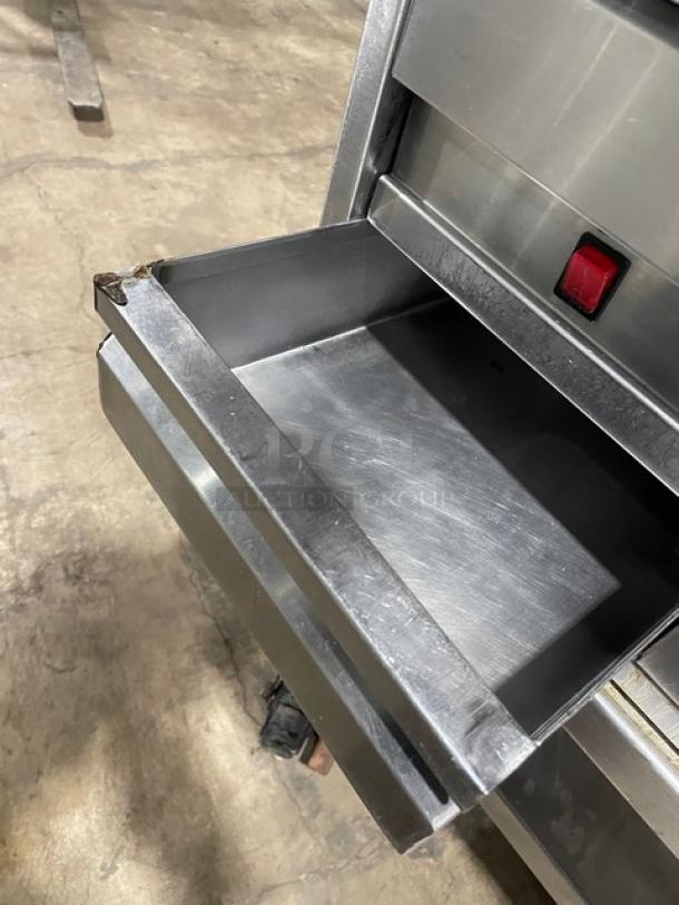 Commercial stainless steel natural gas flat griddle with thermostatic controls, back/side splash, and single undershelf.