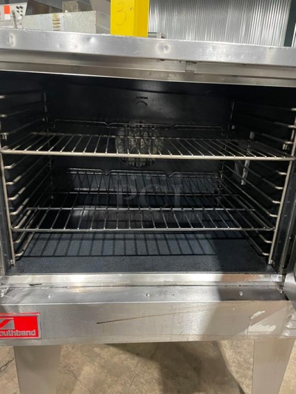 Southbend Marathoner Gold Series stainless steel single stack convection oven, wired racks, thermostatic control, on legs.