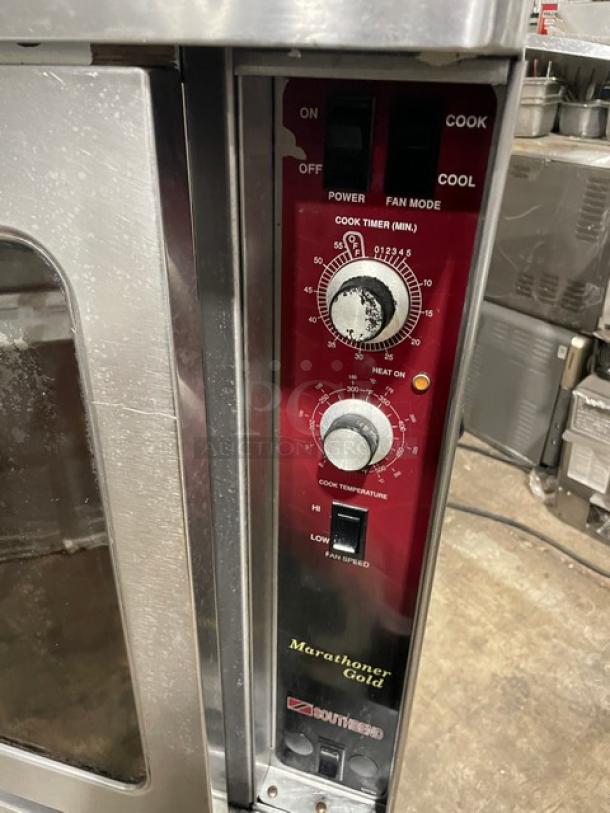 Southbend Marathoner Gold Series commercial stainless steel electric convection oven, thermostatic control, oven racks, on legs.