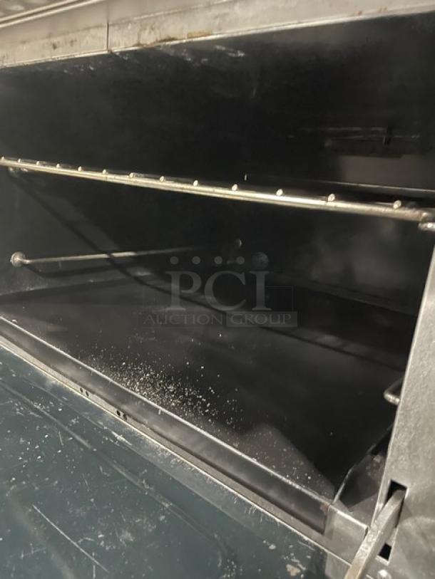 Southbend Model 4364D commercial stainless steel oven interior with wired rack; part of a 6-burner range/oven combo.