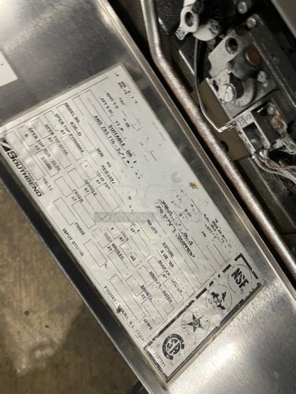 Southbend 4364D stainless steel gas range label, on legs. Features commercial-grade 6-burner oven, backsplash, salamander shelf.