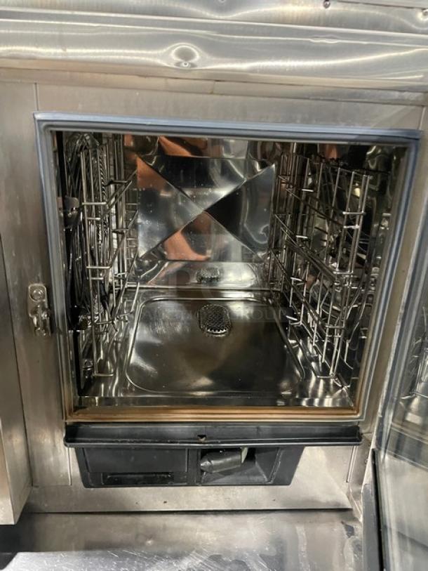 Rational SelfCookingCenter XS Series combi oven, stainless steel, model SCCXS62/3EUV+, with exhaust hood, clean interior.