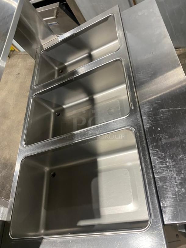 Duke AeroHot stainless steel 3-well steam table, Model E303SWM, with serve-over shelf, rear tray slide, and undershelf.