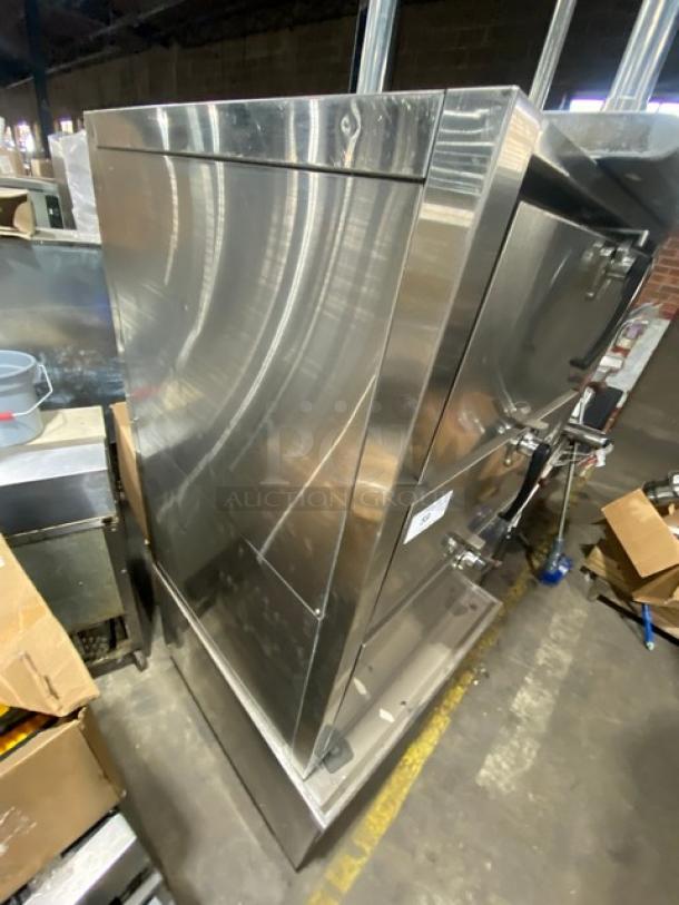 Commercial stainless steel natural gas 3-compartment steamer cabinet with individual controls, oven racks, on legs.