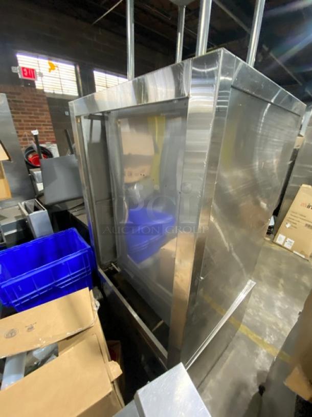 Commercial stainless steel 3-compartment natural gas seafood/rice steamer cabinet with individual controls and wired oven racks.