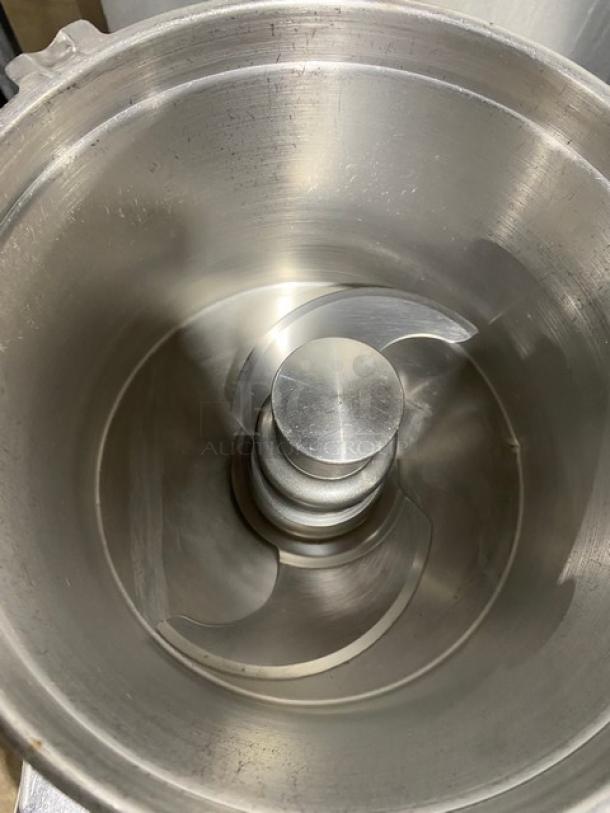 Robot Coupe R602VV commercial food processor with 7 Qt. stainless steel bowl, visible interior blades, on legs, 120V, used condition.