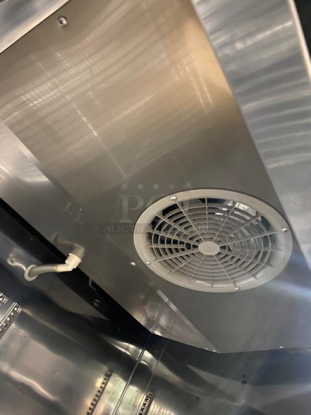 Turbo Air TSR35SD commercial refrigerator interior view, showing fan and stainless steel finish. Includes wired racks.