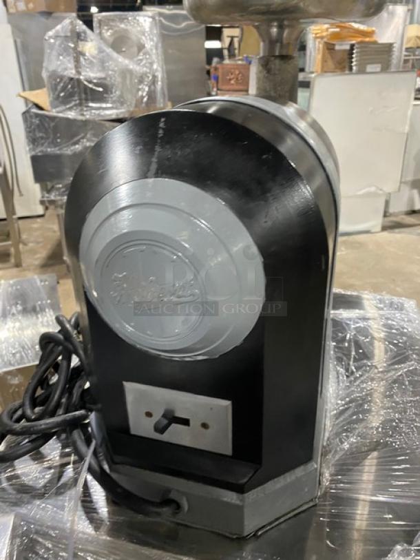Hobart Model 4722 commercial black electric meat grinder with stainless steel feed pan, showing brand logo and power cord.