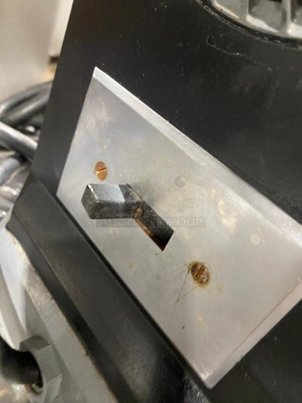 Hobart Model 4722 commercial meat grinder switch panel, black finish, shows wear, stainless steel feed pan included.