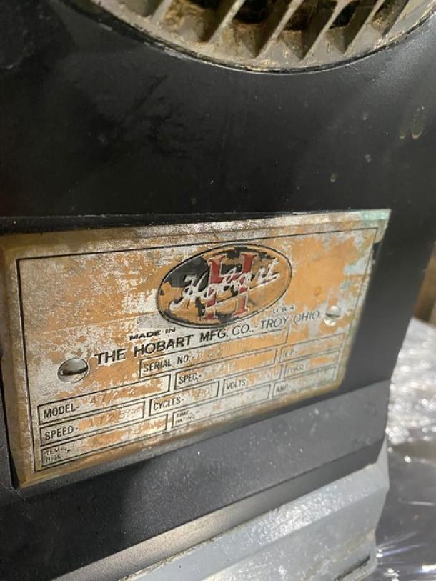 Hobart Model 4722 black electric meat grinder with stainless steel feed pan. Serial No: 882100. Visible wear on label.