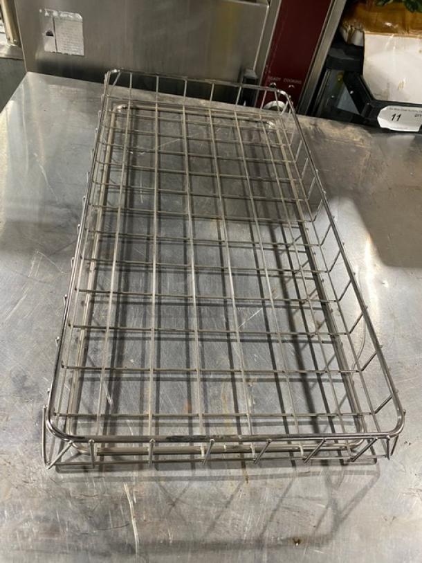 Chrome plated full-sized bagel/pastry wired rack, commercial use, good condition, grid design, durable metal construction.