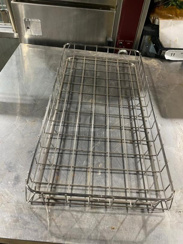 Chrome-plated full-sized bagel/pastry wired rack, excellent condition, durable design. Ideal for commercial use.