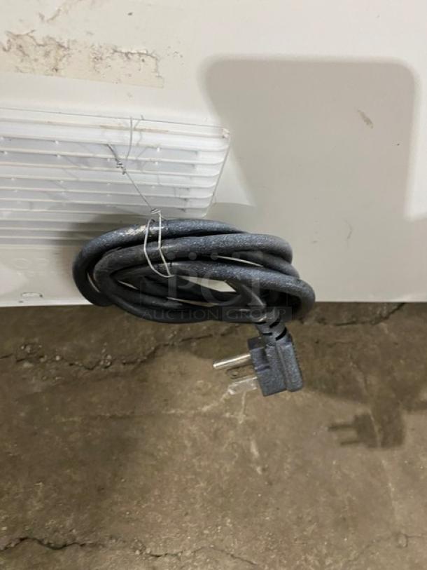 Vissani MDCF7WH chest freezer power cord detail; white, manual-defrost, used condition.