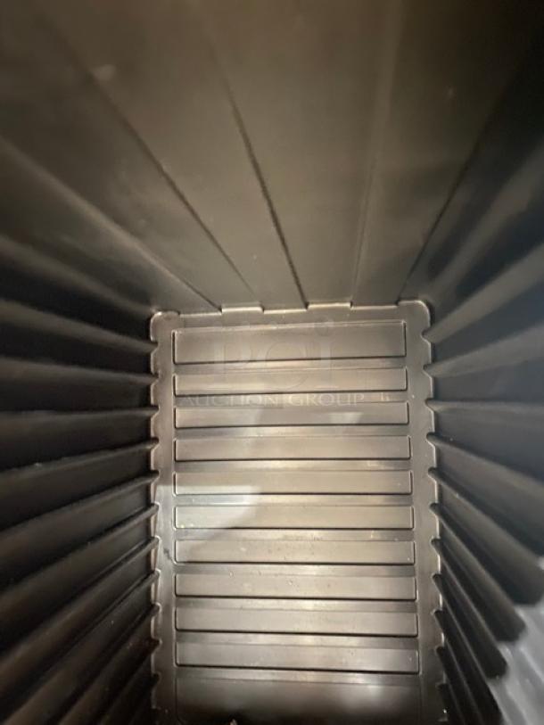 Cambro Ultra Series black insulated food pan carrier interior, ribbed walls, durable condition. Ideal for commercial use.