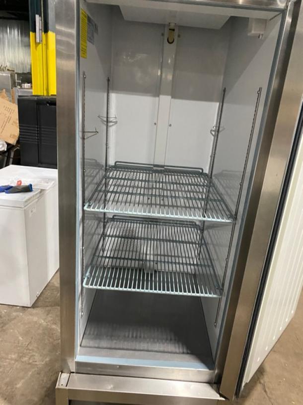 Artic Air AF23 stainless steel single-door freezer with poly coated wire racks, 115V, on casters, model SN: 253187.