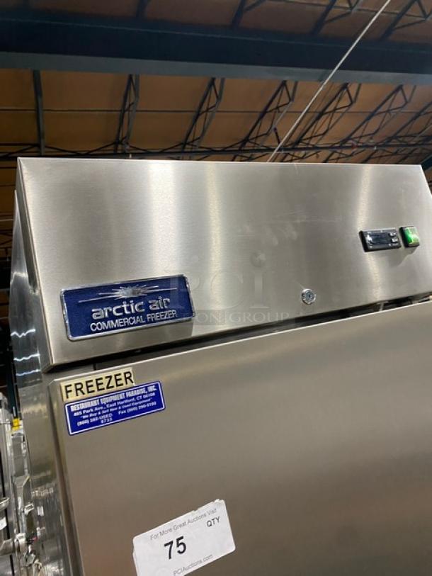 Artic Air AF23 stainless steel reach-in freezer, single door, poly-coated wire racks, 115V, on casters, commercial use.