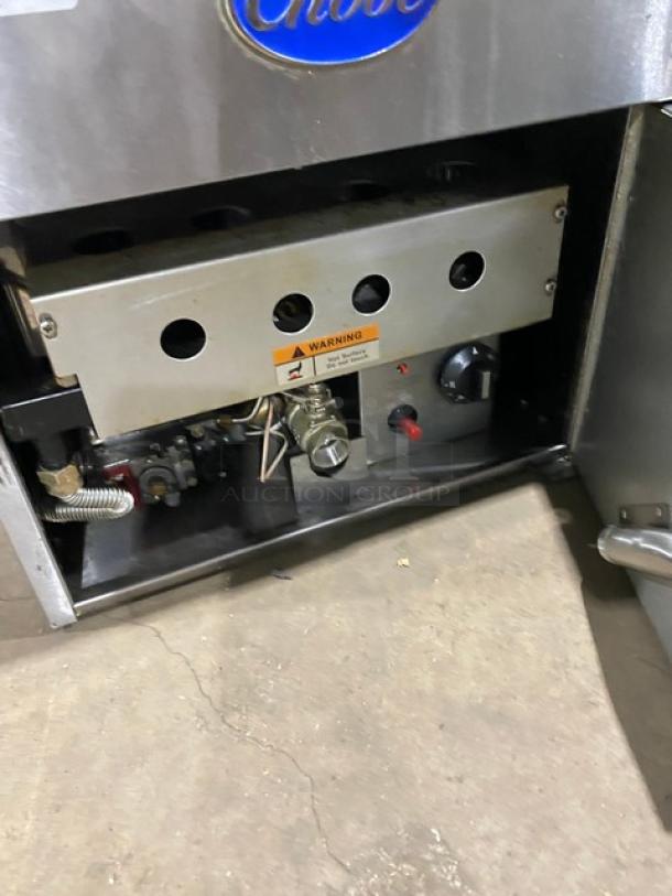Globe stainless steel natural gas countertop deep fryer, featuring backsplash and basket hanger. Appears in good condition.