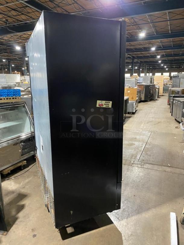 Kool-It Model 163LX46FB black double glass door commercial freezer, Signature Series, with wire racks and casters.