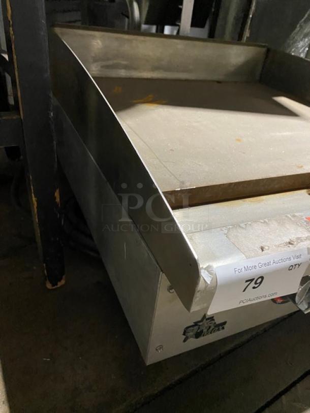 Star Max Series stainless steel electric griddle with thermostatic controls, back and side splash, on legs, in used condition.