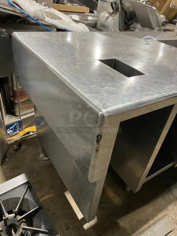 Custom stainless steel double compartment sink workstation with goose neck swivel faucet and enclosed cabinet base.