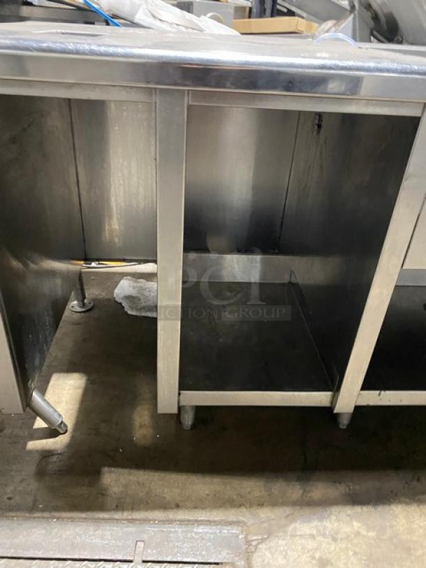 Commercial stainless steel double compartment handwashing/prep sink workstation with goose neck swivel faucet, enclosed cabinet base, and legs.