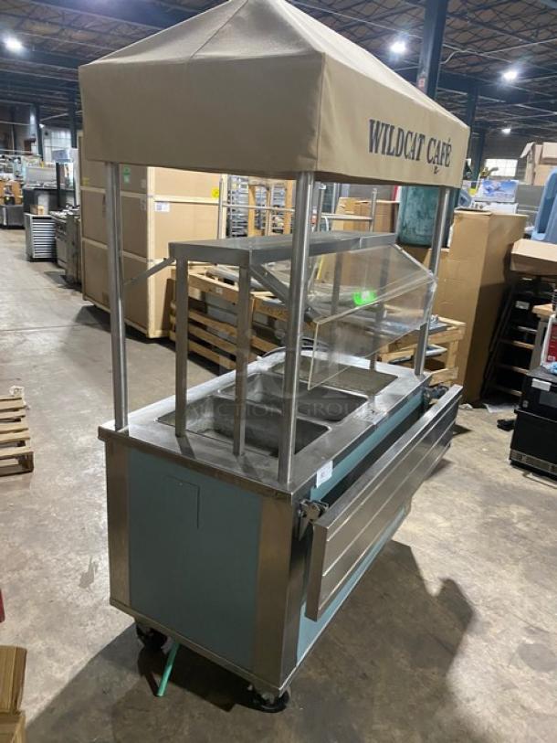 Piper Products 3-Well Hot Food Table, stainless steel, foldable tray slide, sneeze guard, "Wildcat Cafe" awning, on casters.
