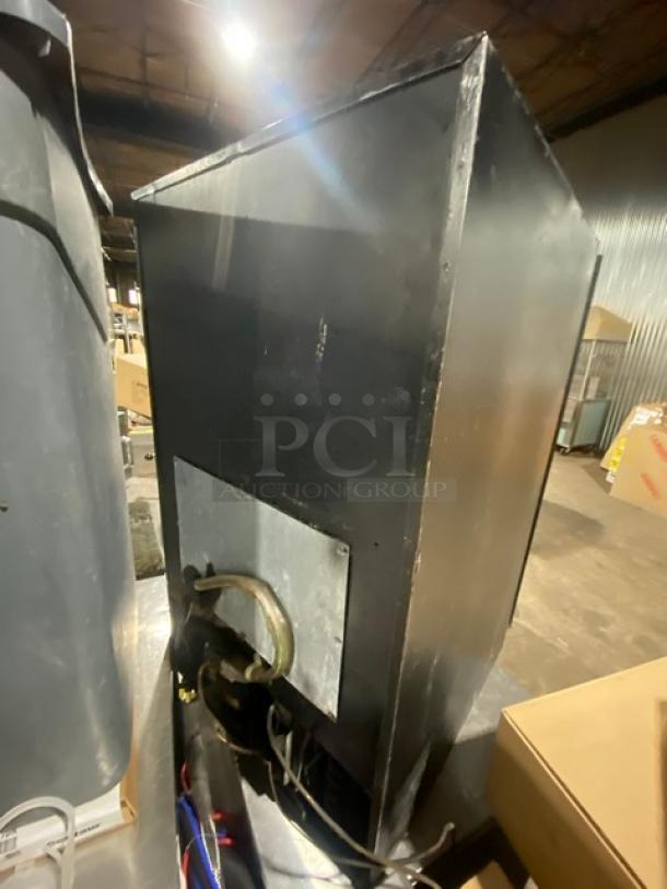Beverage-Air commercial refrigerator, model UR30G, black, single glass door, poly-coated wire racks. 115V, 1-phase, SN: 7255177.