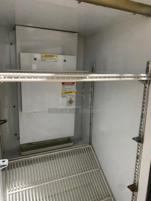 Beverage-Air UR30G countertop merchandiser refrigerator with single glass door, poly-coated wire racks, and caution label.
