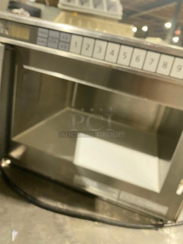Panasonic NE-17521 stainless steel countertop microwave with programmable touch controls, 208V 1 Phase, clean interior.