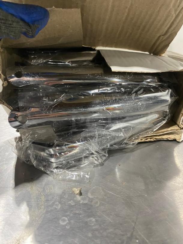 New American Metalcraft nickel-plated 8" pizza pan gripper, Model I9540, unopened packaging in box.