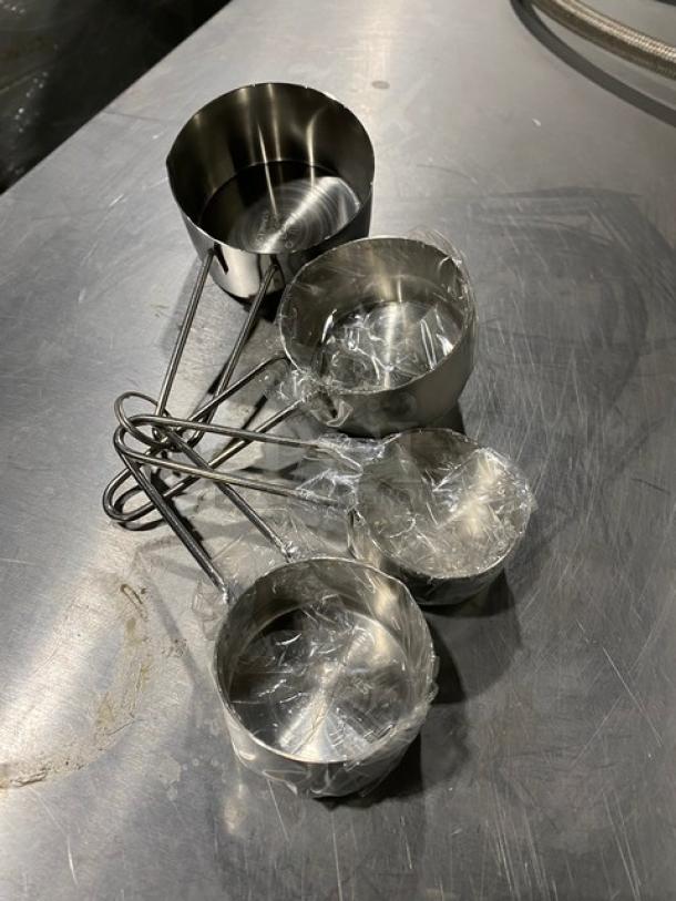 American Metalcraft MCW-4 stainless steel measuring cup set, new condition, plastic wrapped, heavy-duty construction.