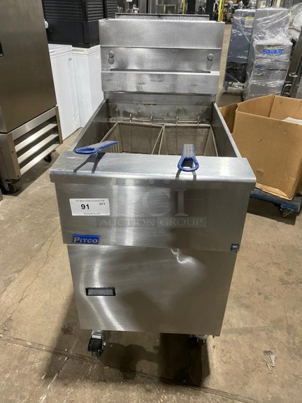 Pitco SG18S commercial stainless steel deep fat fryer, 65 lb capacity, natural gas, with baskets, backsplash, on casters.