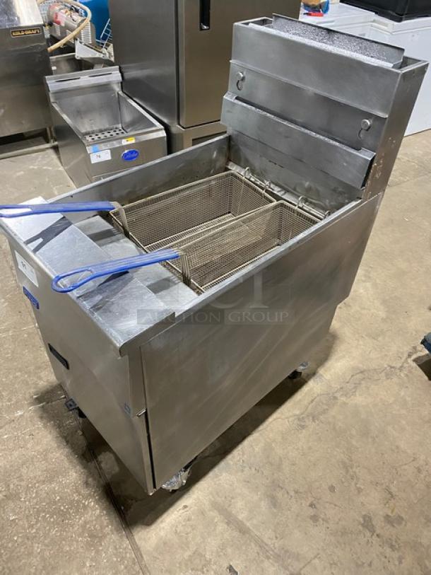 Pitco SG18S commercial stainless steel 65 lb. deep fryer with back splash, basket hanger, fry baskets, on casters. Natural gas-powered.