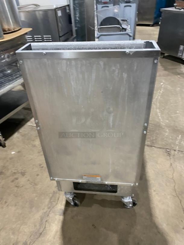 Pitco SG18S commercial stainless steel natural gas fryer, 65 lb. capacity, with backsplash, basket hanger, and fry baskets, on casters.