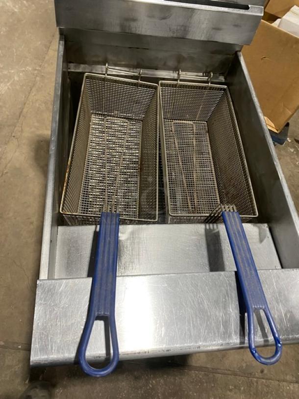 Pitco SG18S commercial stainless steel natural gas fryer with baskets, backsplash, and basket hanger, on casters.