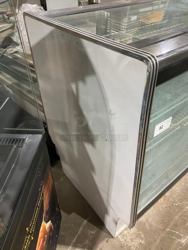 American Metalcraft MCW4 commercial white glass refrigerated display case, poly-coated wire racks, sliding rear doors.