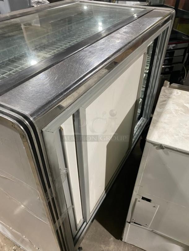 American Metalcraft MCW4 refrigerated deli display case, white with straight glass, poly coated wire racks, rear sliding doors.