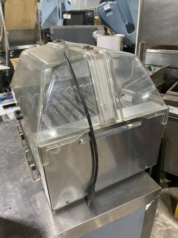 Star Commercial Stainless Steel Electric Hot Dog Roller, Model 258, with clear cover; countertop design, on legs, 120V.