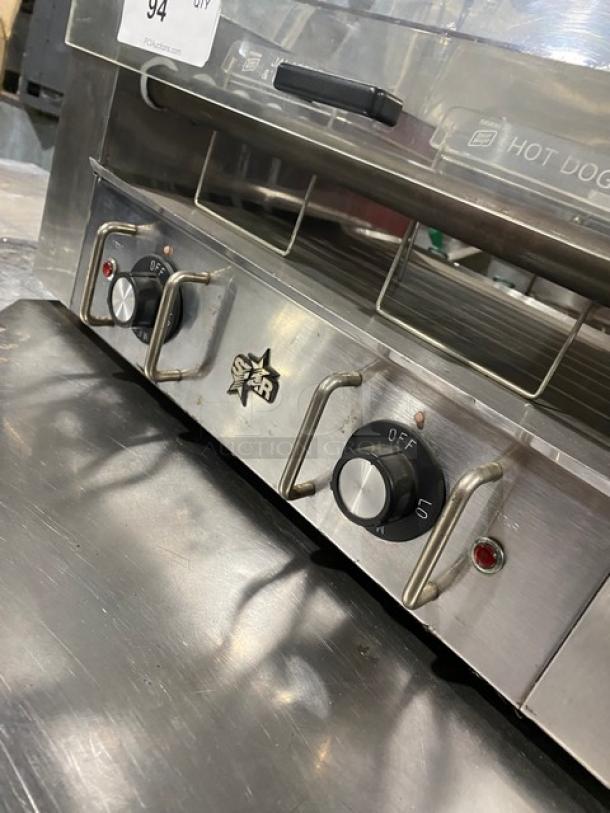 Star Commercial Stainless Steel Hot Dog Roller, Model 258, with clear cover. Features temperature controls, 120V, sturdy legs.