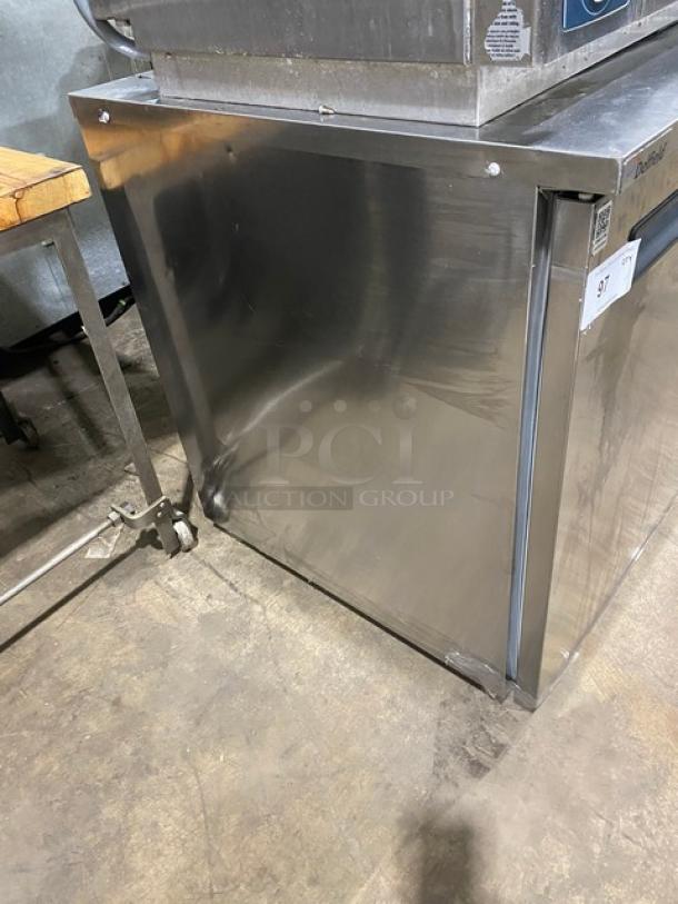 Delfield stainless steel undercounter refrigerator, model 406P-STAR2, features poly coated wire rack, 115V 1 phase, on casters.