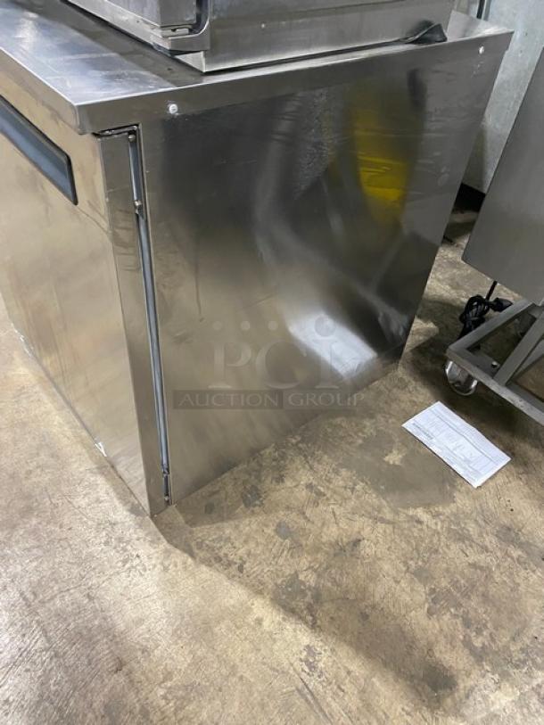 Delfield stainless steel single door undercounter refrigerator, model 406PSTAR2, features poly coated wire rack, on casters.