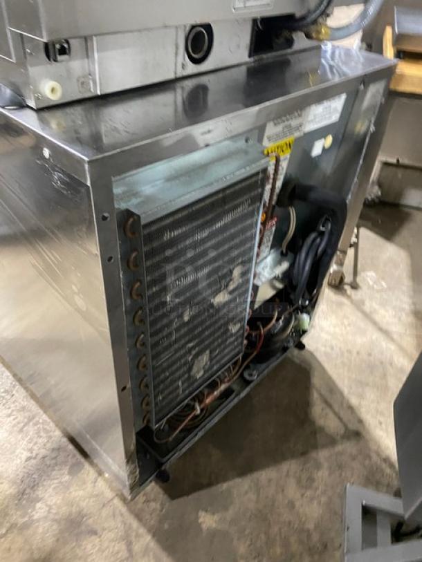 Delfield 406P-STAR2 stainless steel undercounter refrigerator, poly coated wire rack, visible mechanics, on casters, 115V 1 phase.