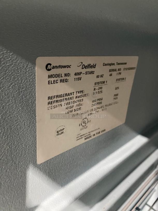Delfield 406PSTAR2 Stainless Steel Single Door Undercounter Refrigerator with poly-coated wire rack, model details label visible.