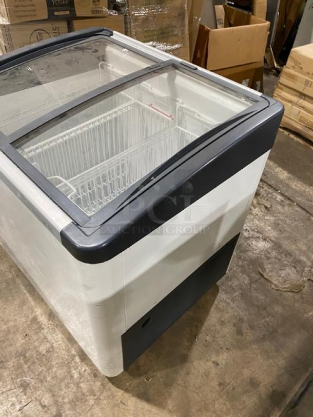 Liebherr EFI2053 commercial white ice cream display freezer with curved top, double sliding glass doors, poly-coated wire baskets, 115V, on casters.